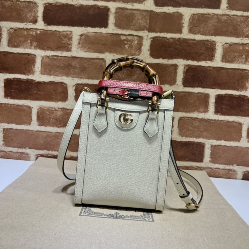 G*u*i top handle bags